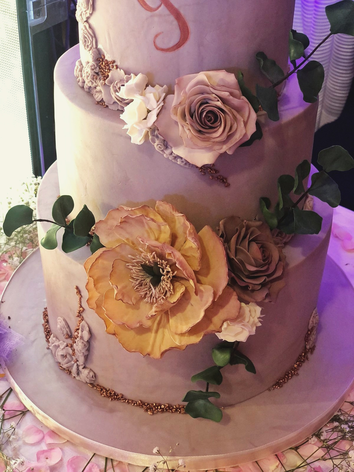 Mauve wedding cake with an apricot sugar peony
